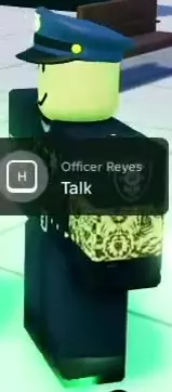 Officer Reyes wearing a blue police cap and dark uniform.