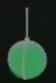 Green wrecking ball suspended from a cable.