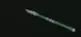 Slender green spear construct.